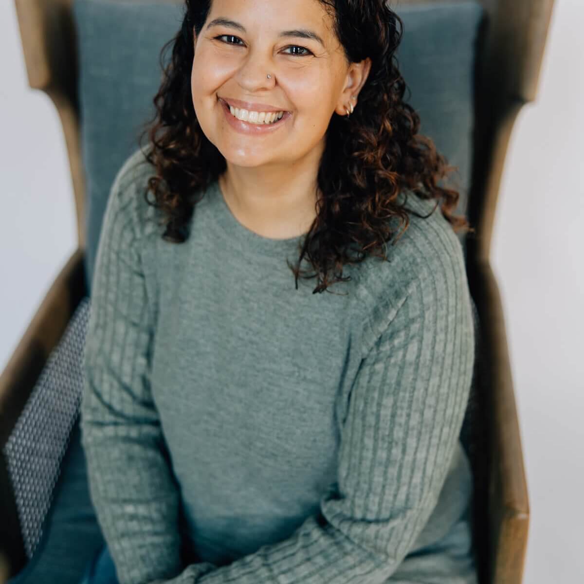 Anastasia Corbin Sitting on Chair